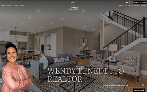 Wendy Benedetto | Mirambell Realty website homepage &mdash; a staged living room with the agent's headshot and 'Wendy Benedetto, Realtor' over a property search bar.