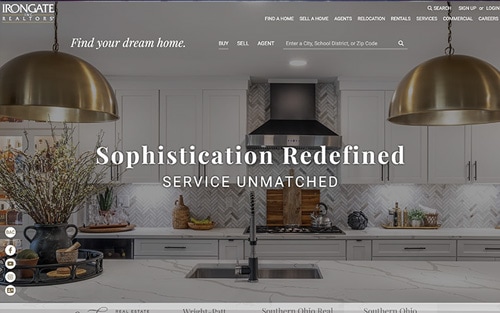 IronGate Realtors website homepage &mdash; a luxury kitchen with brass pendants and 'Sophistication Redefined, Service Unmatched' over a property search bar.