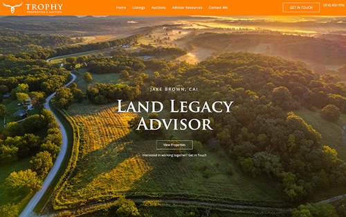 Jake Brown | Trophy Properties & Auction website homepage &mdash; an aerial view of rolling countryside at sunrise with 'Land Legacy Advisor' and a View Properties button.