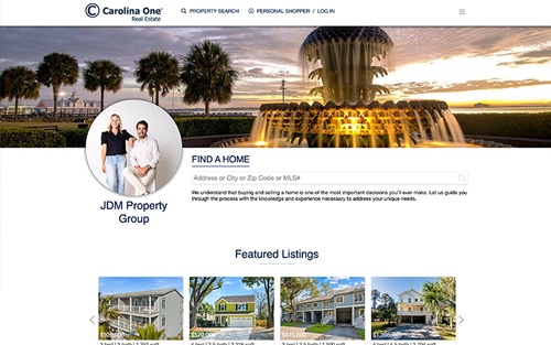JDM Property Group | Carolina One Real Estate website homepage &mdash; the Charleston Pineapple Fountain at sunset with the team headshot and a Find a Home search bar.
