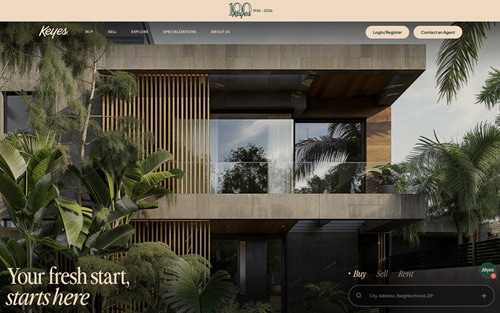 The Keyes Company website homepage &mdash; a modern luxury home framed by tropical foliage, with 'Your fresh start, starts here' and a property search bar.